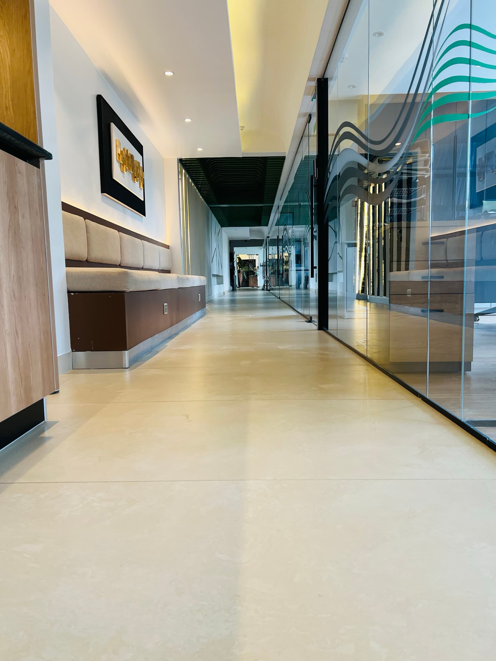 Renegade Air — Command: executive corridor with banquette seating and branded glass partitions, Nairobi