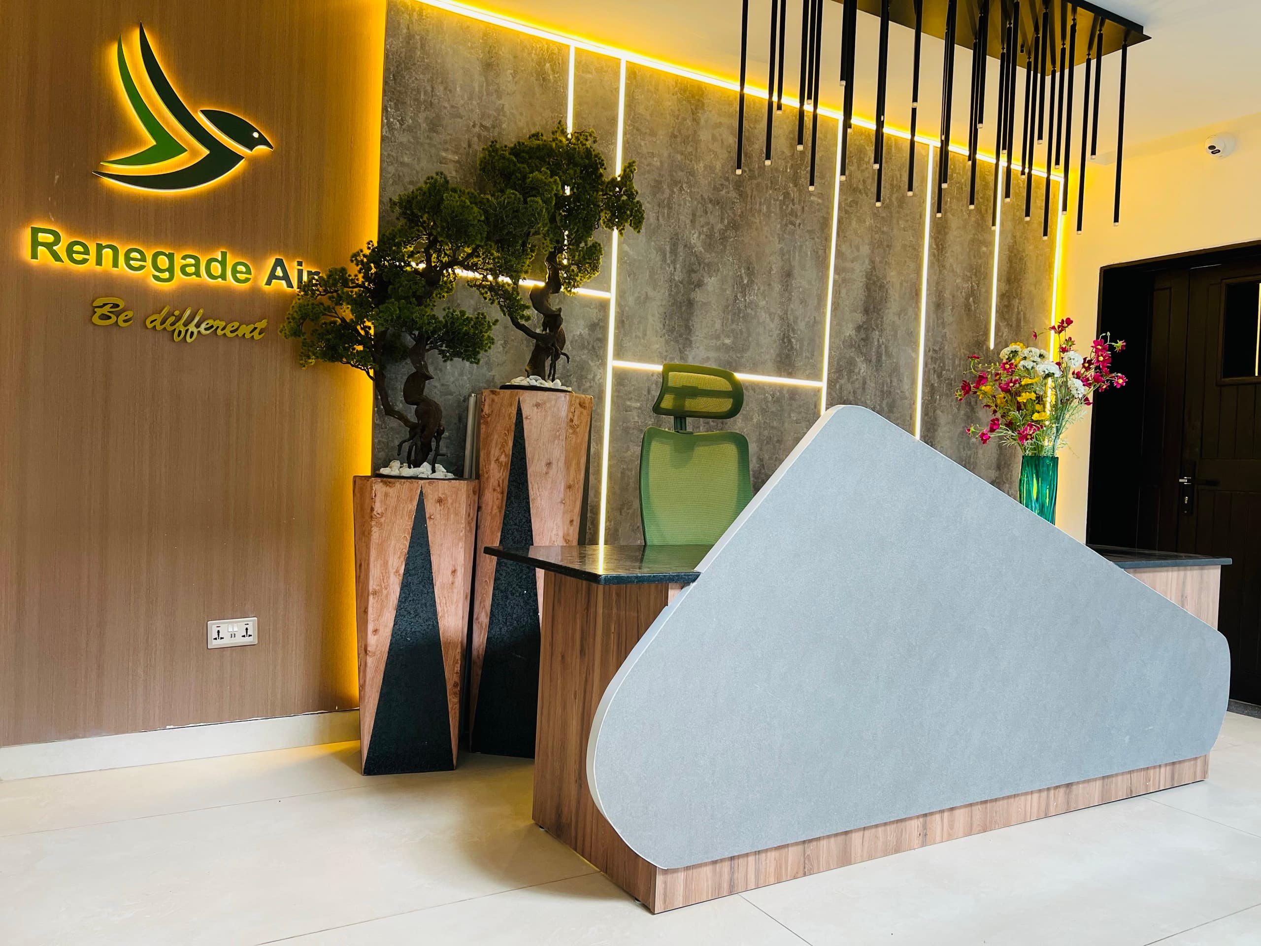 Renegade Air — Command · branded reception and wing-shaped desk